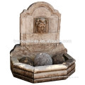 Roman style antique stone hand carved limestone man head wall fountain